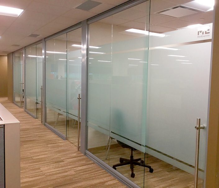 Glass-offices-with-locking-sliding-frameless-glass-doors 